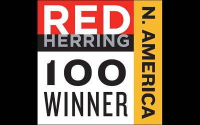 Deep Chakraborty, CEO of Enact accepts the Red Herring Award in 2023