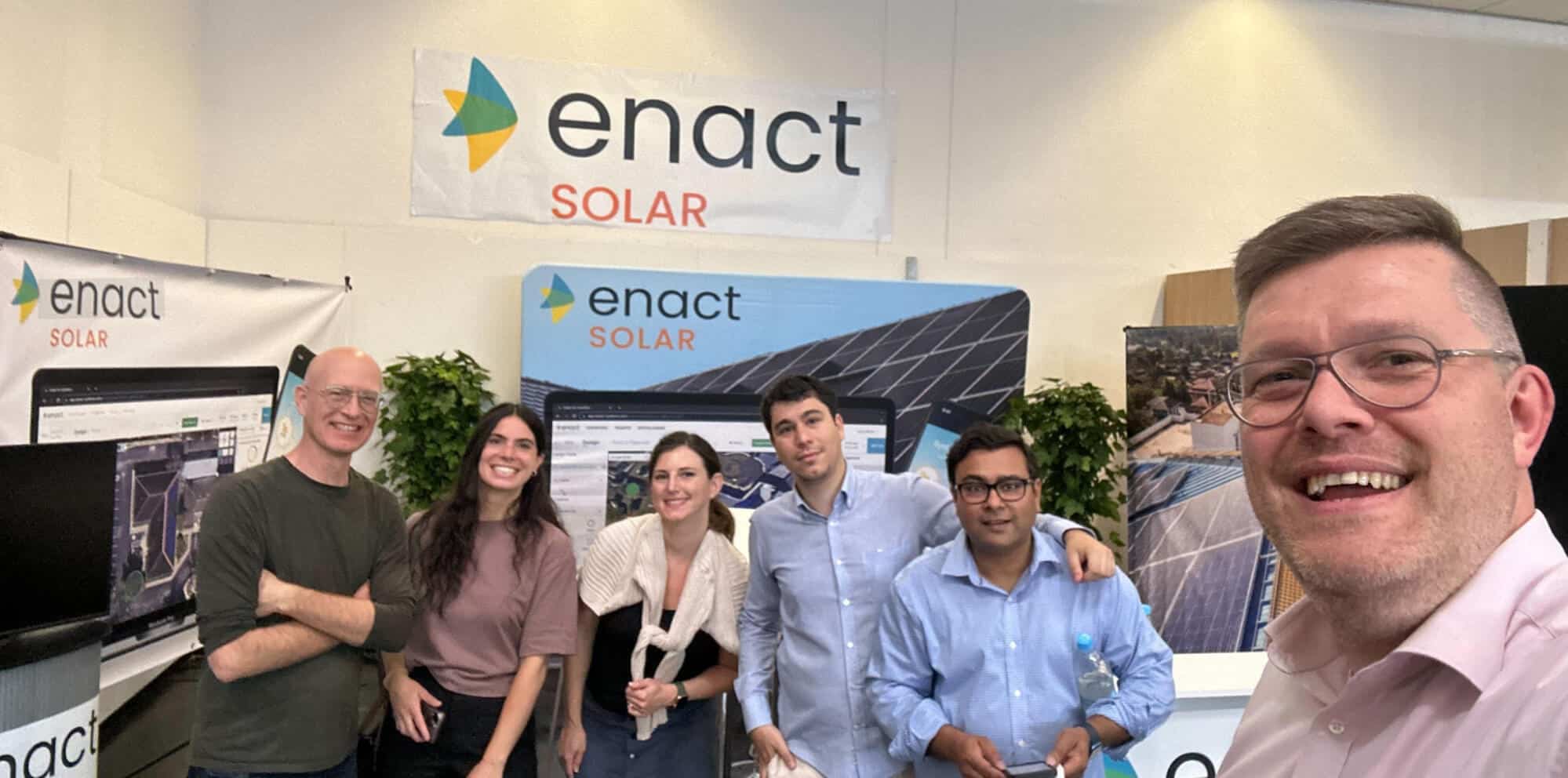 An image of six Enact team members in front of the Enact Solar exhibition booth at a German solar energy trade show, demonstrating our local commitment to enabling solar installers to grow their business in Germany.