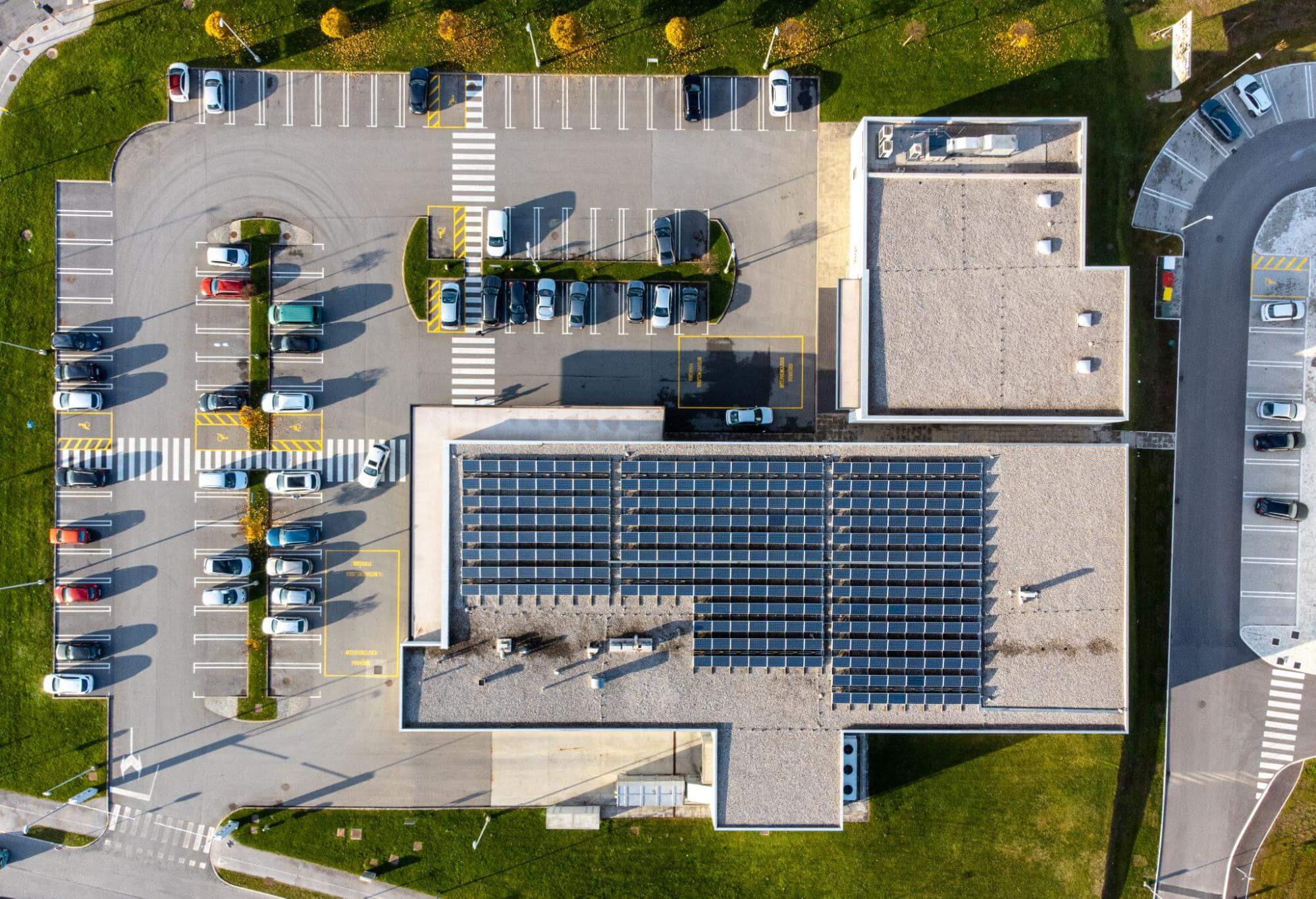 A commercial building with rooftop arrays of solar panels