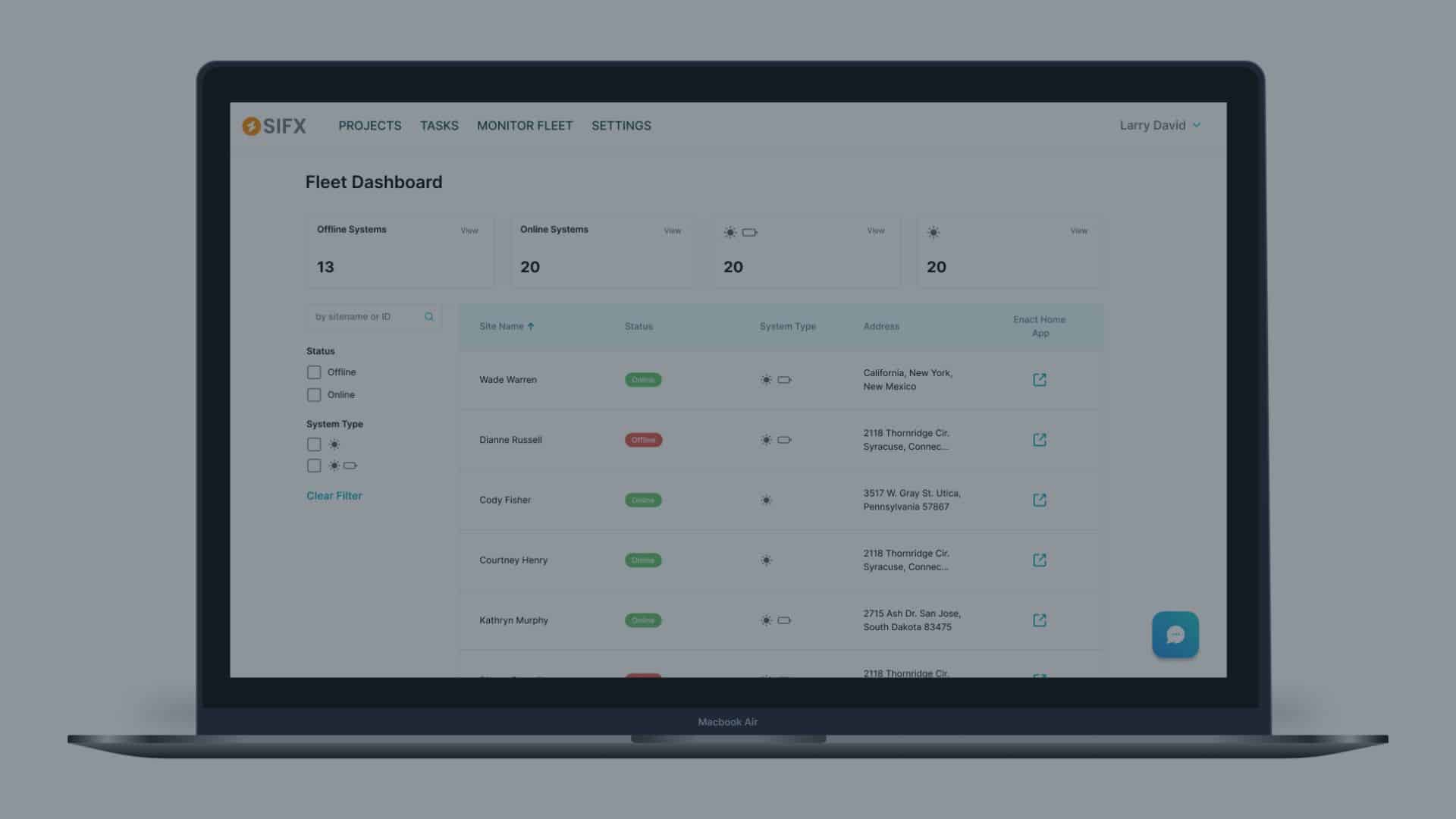 A MacBook Air displaying the Enact solar fleetview dashboard for installers. The interface lists multiple solar sites with their online or offline status, system type icons, and customer addresses, allowing remote monitoring and quick issue identification.